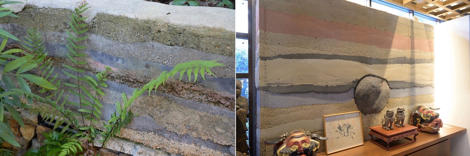 玄関に設られた版築の庭。独特な世界観を醸し出している。