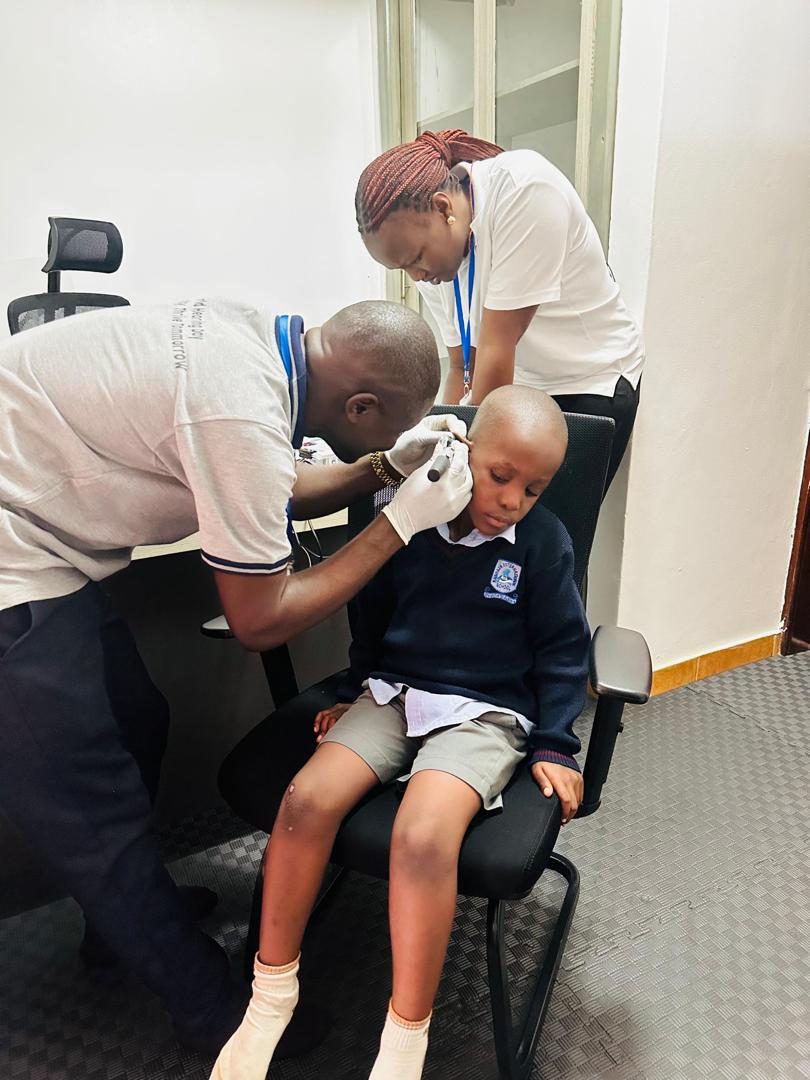A school building stands against the backdrop of a clear sky