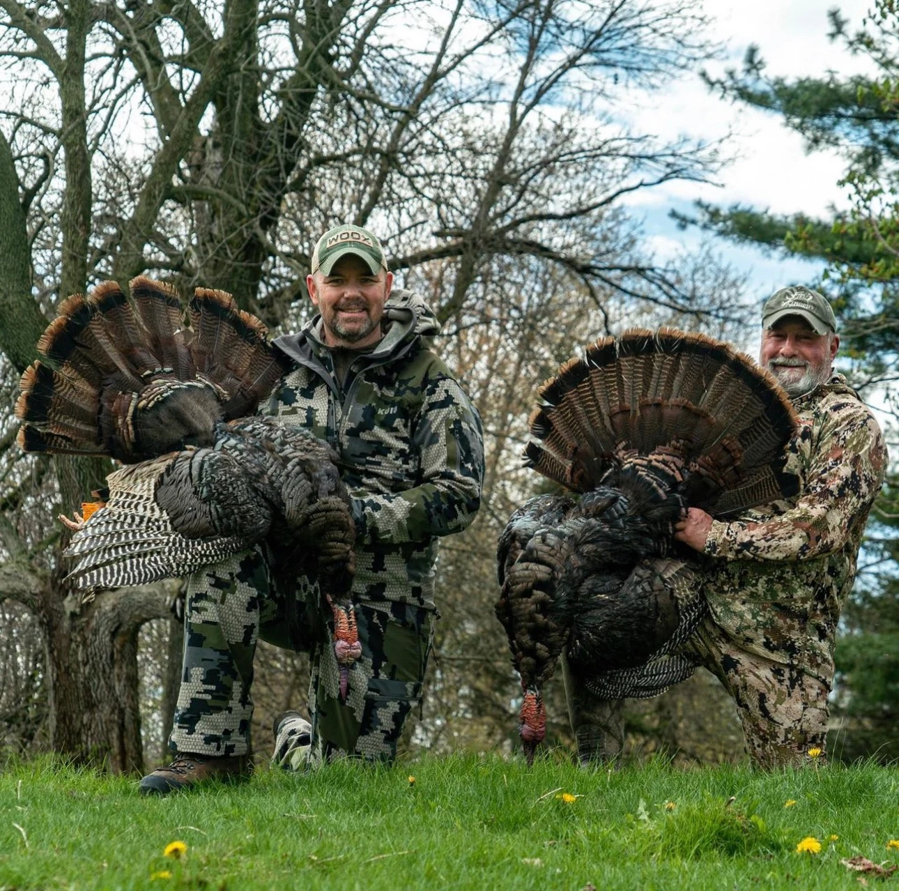 Two people outdoors with birds
