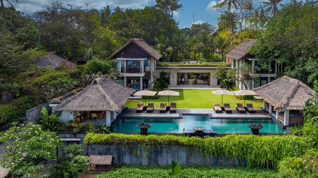 Professional real estate agent showing iconic coastal landmarks near Seseh, Bali for premium property investors.