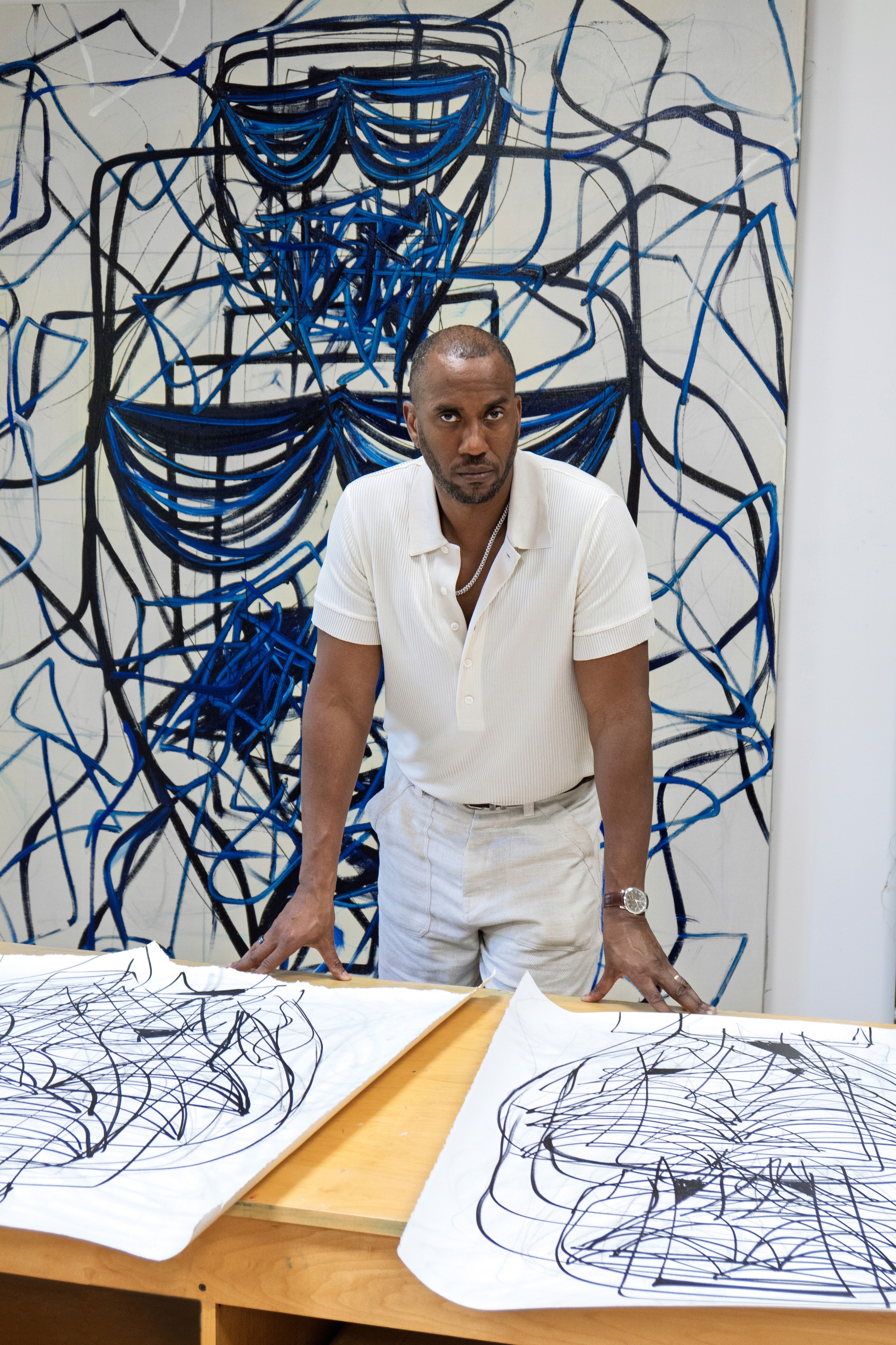 Rashid Johnson Portrait in front of his drawings