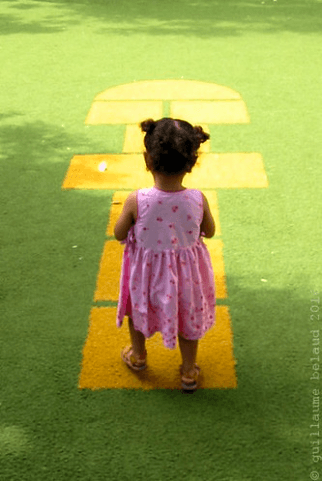 A woman receives a relaxing energy healing in a serene setting with soft lighting.