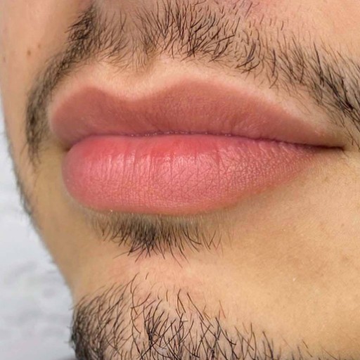 Crop view of male lips, after the procedure