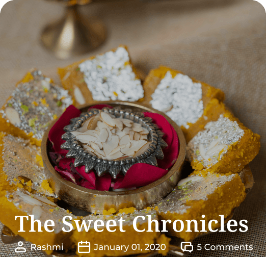 Traditional Indian sweets decorated with silver foil and almond garnishing, beautifully arranged in a brass plate, featured in 'The Sweet Chronicles' blog post.