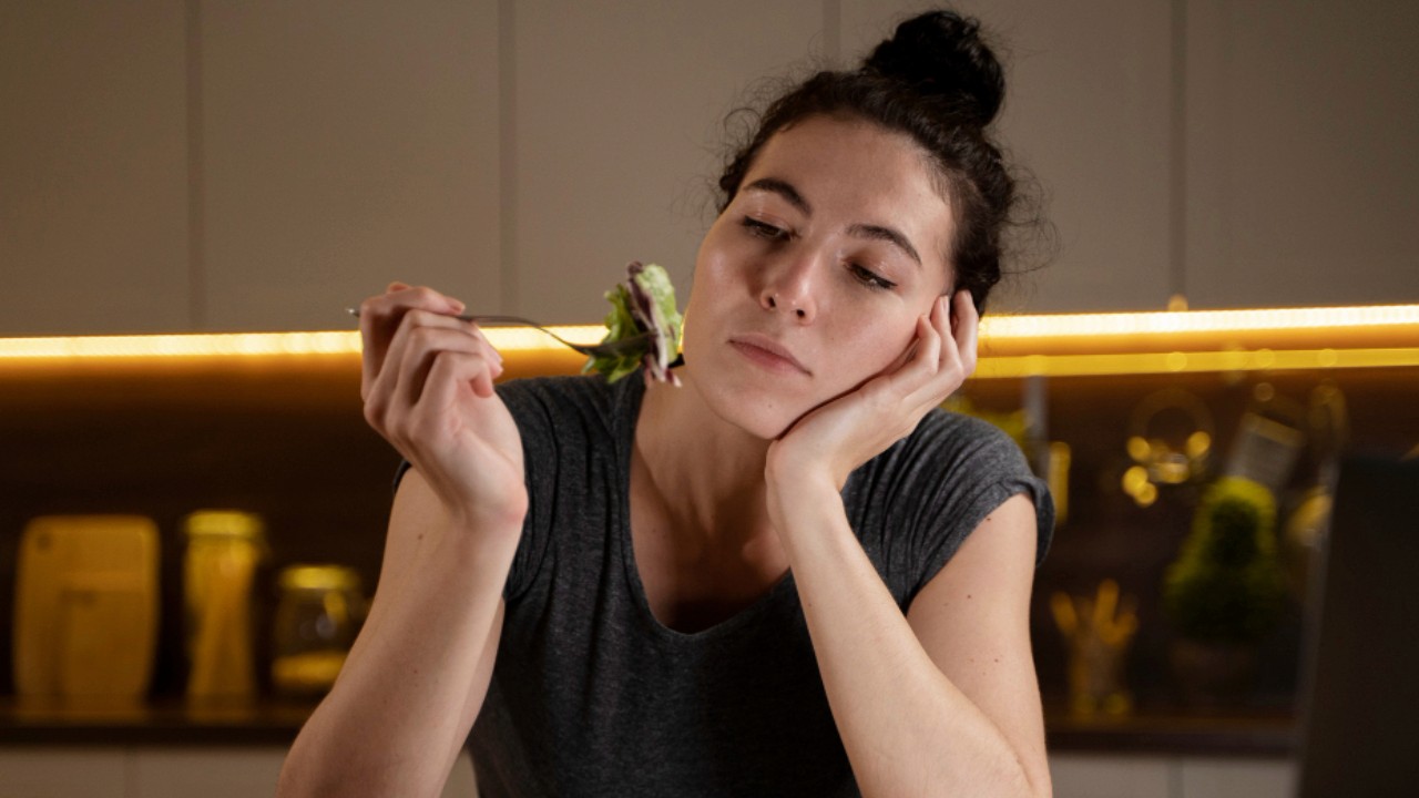 Woman trying to eat healthy at home