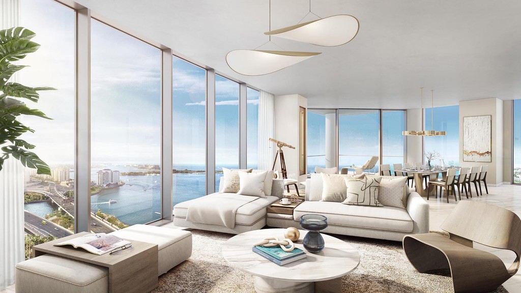 Elegant living room and dining area in a modern apartment at Palm Beach Tower 2, with chic furniture and bright ambiance.