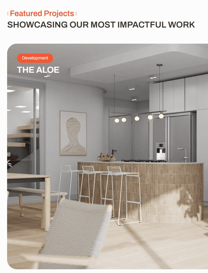 A bright kitchen space with dining table, chairs, a curved kitchen island & white bar stools.