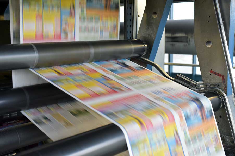 Offset printer printing on long sheets of paper.