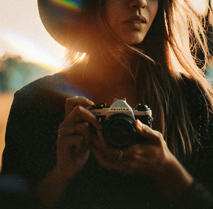girl holding a camera