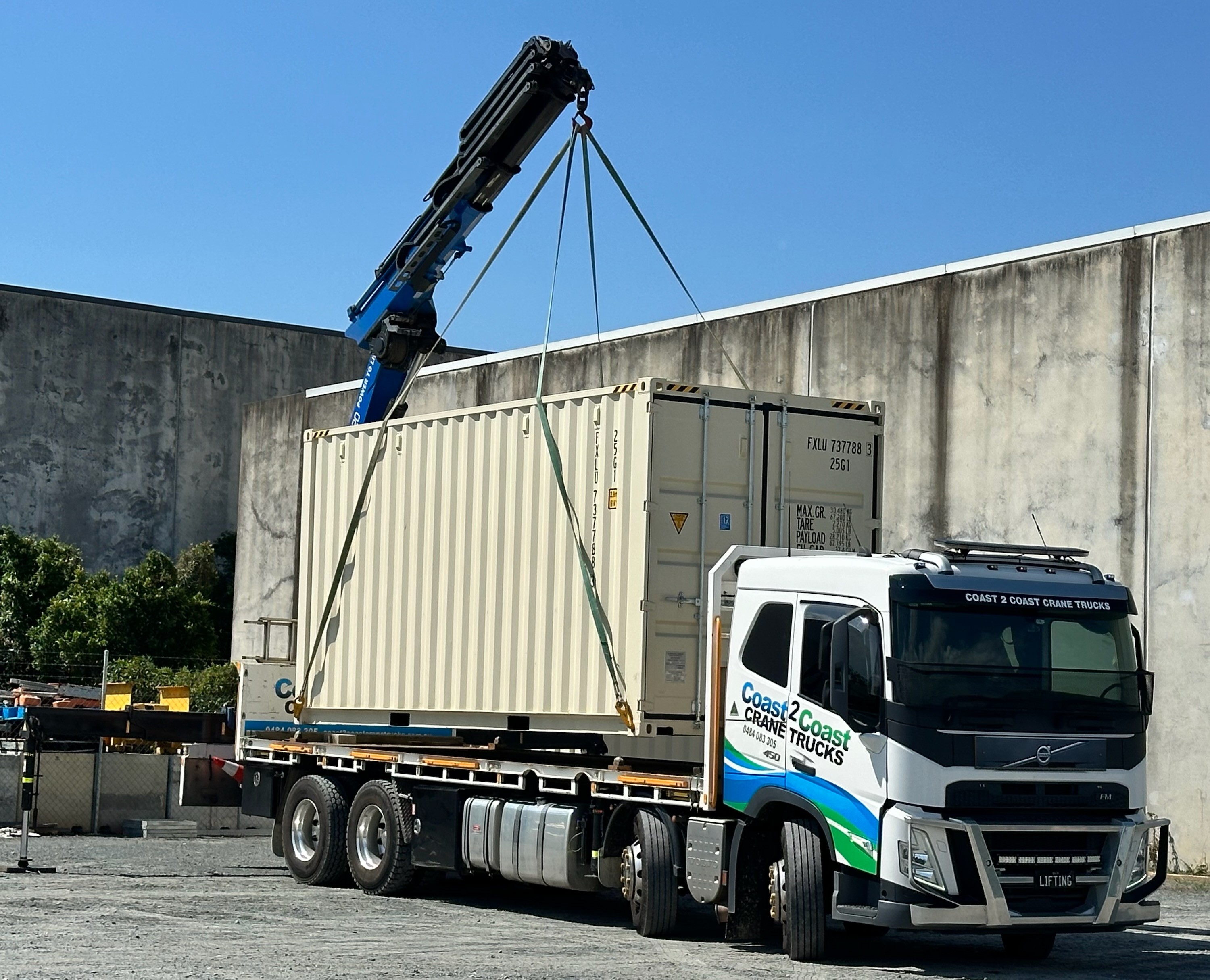 Hiab crane truck lifting sea container