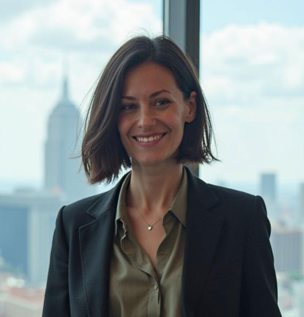 Profile portrait of a man in a white shirt against a light background