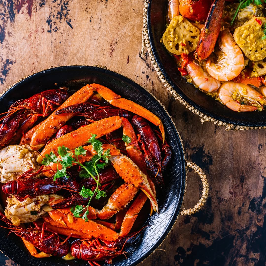 Traditional Beijing-style hot pot at Le Sia, served with fresh lamb and a signature sesame dipping sauce.