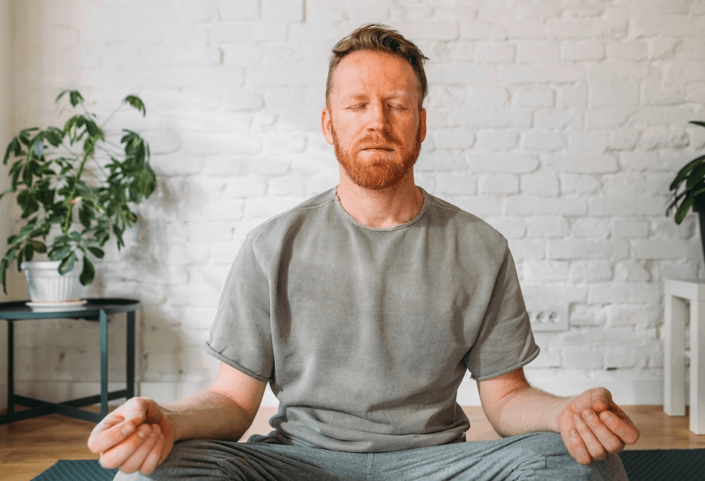 man meditate at home