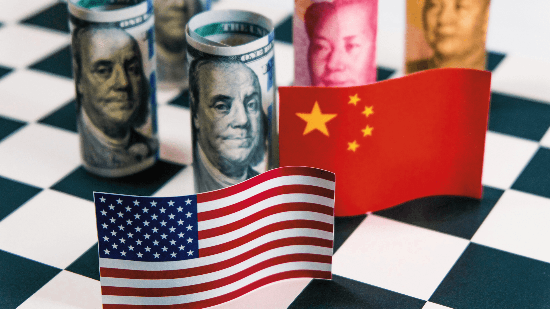 America dollar and Yuan banknote with USA and China flags. Its is symbol for tariff trade war crisis between biggest economic country in the world.