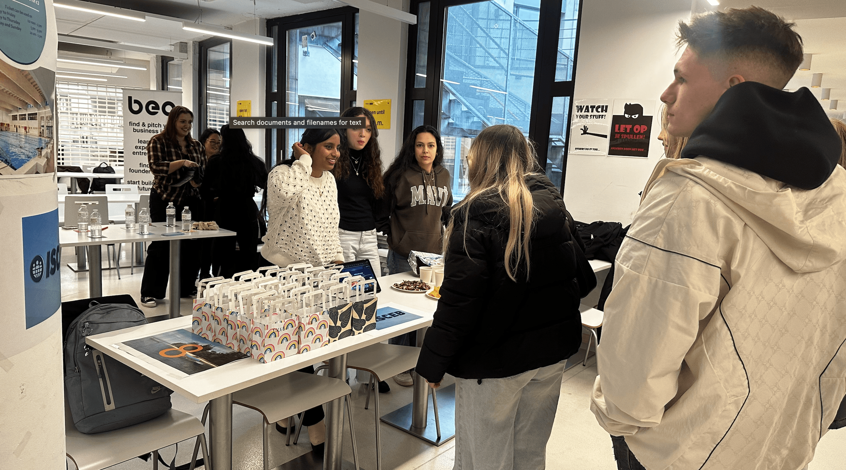 a black and white living room with a large tv