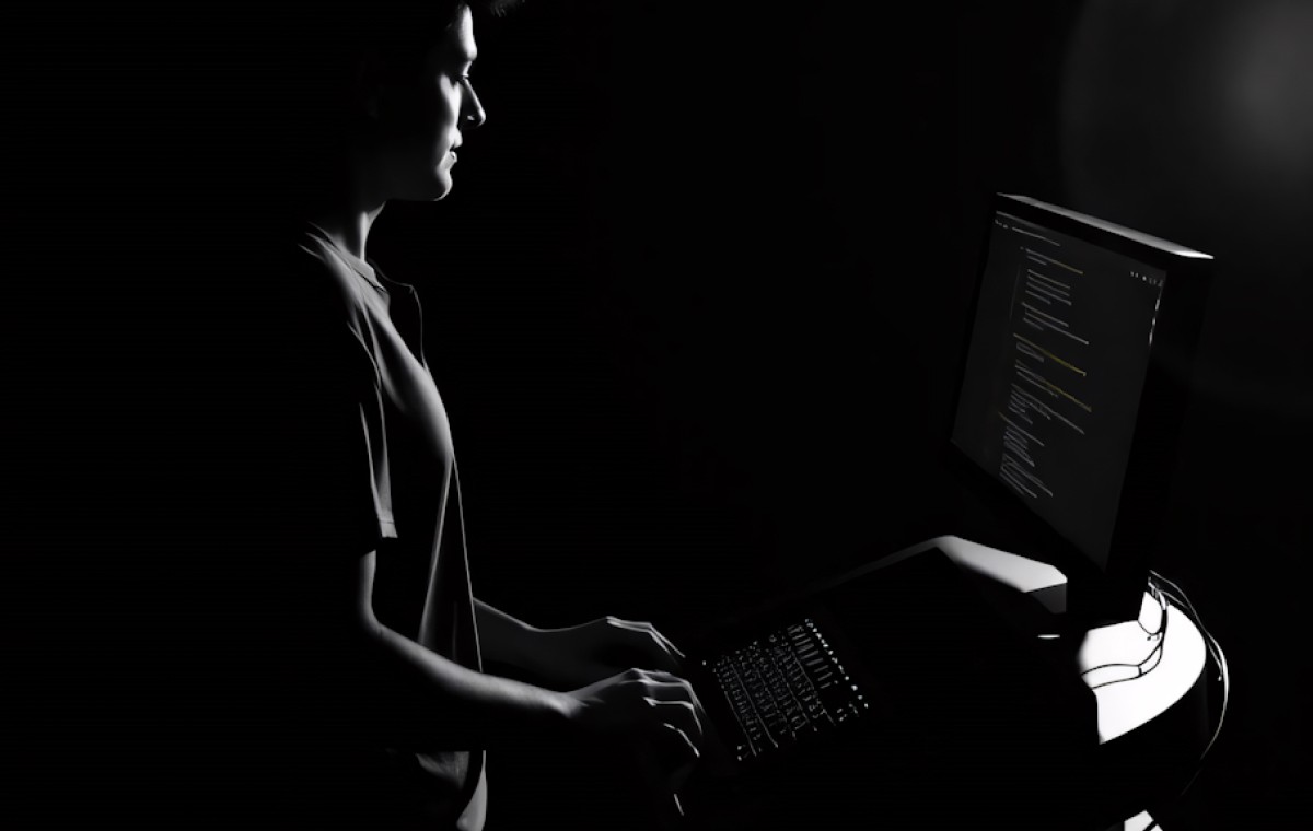 Close-up of a potential client analyzing website content on a monitor, captured in high-contrast black and white to represent deep user engagement.