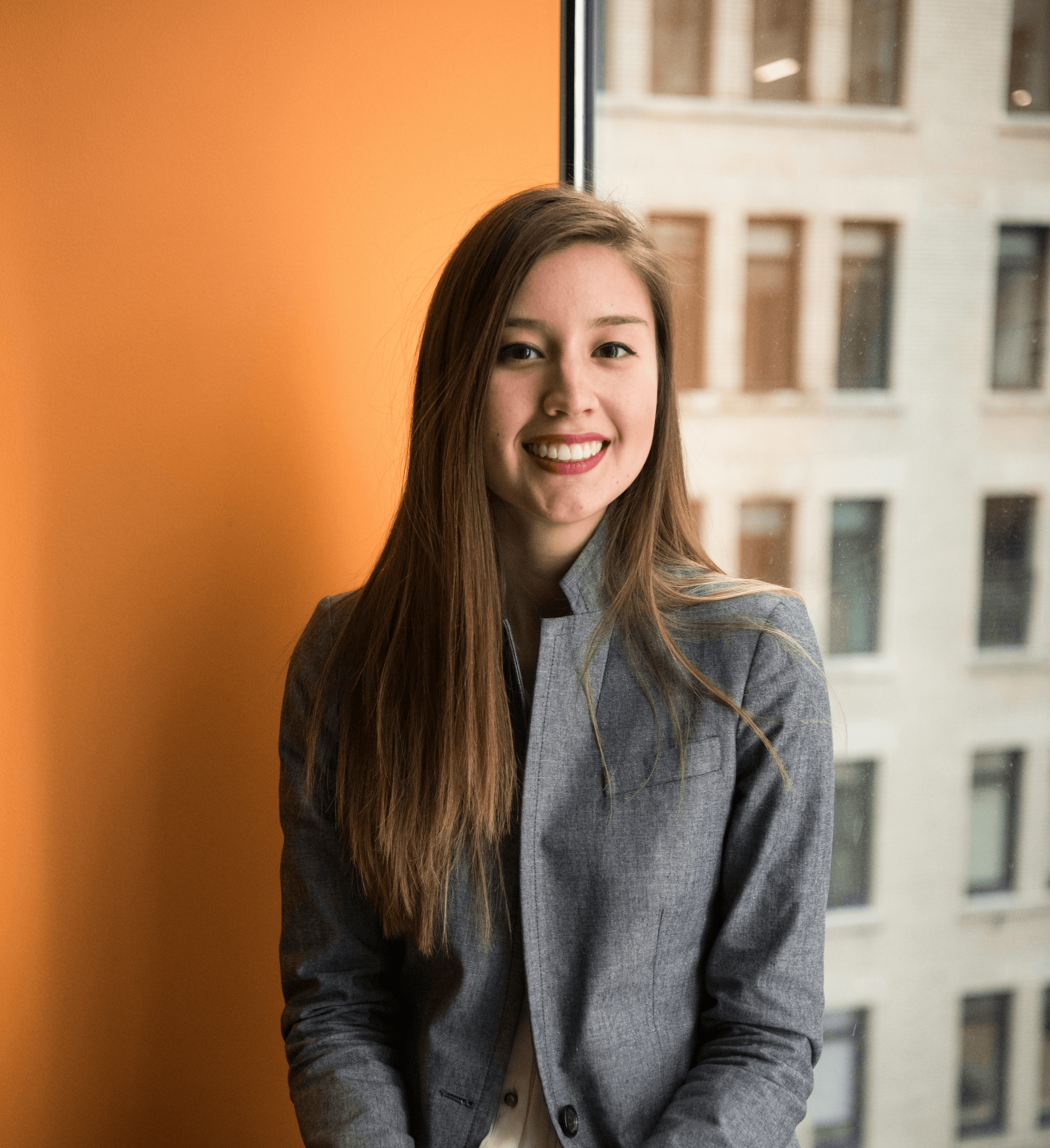 shallow focus photo of woman in gray jacket