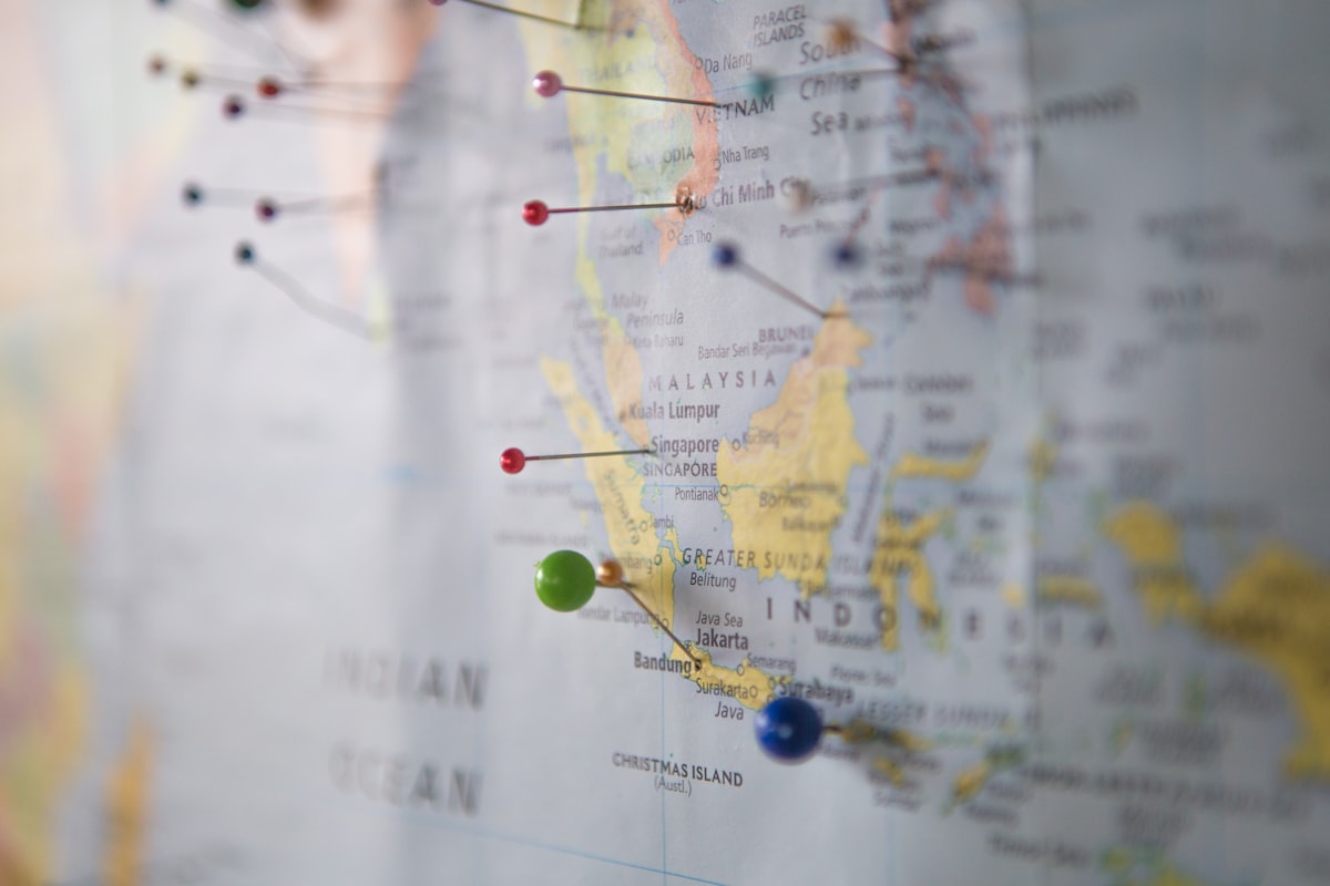 World map with pins marking cheap flight destinations
