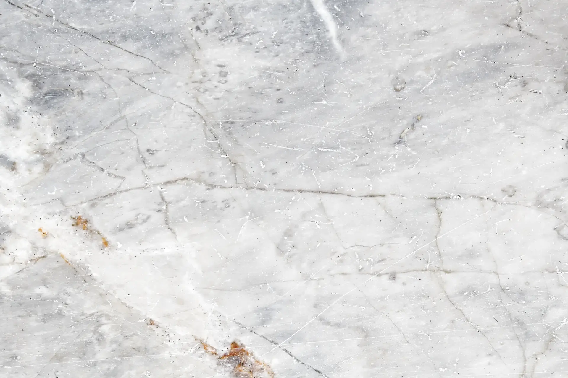 A clean slab of Mugla White marble from Turkey, with delicate light gray veins on a white background.