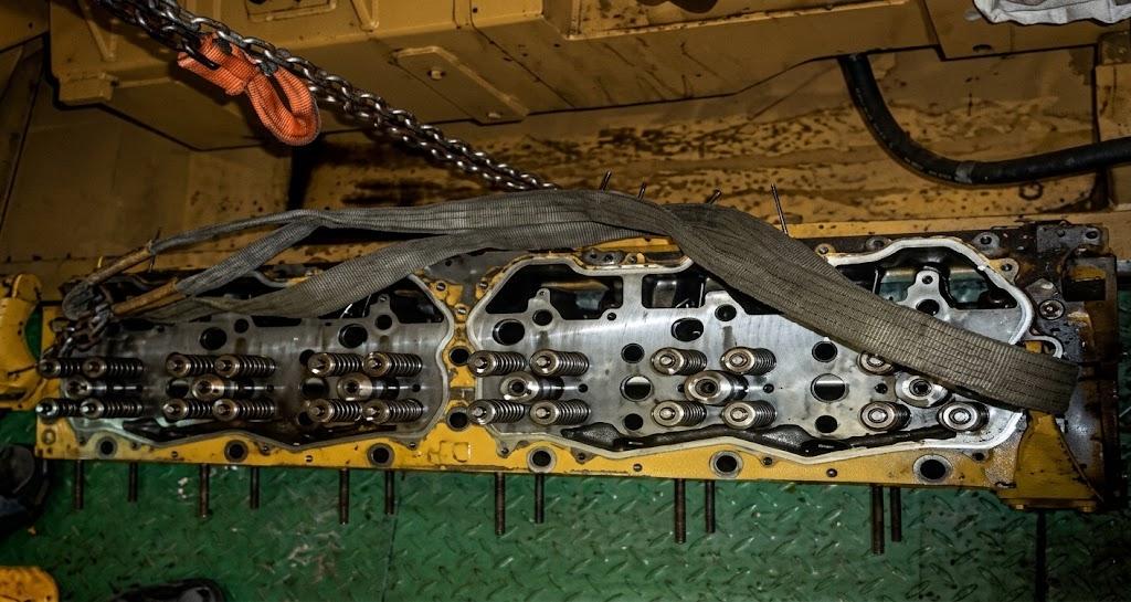 Engine cylinder and piston inspection.