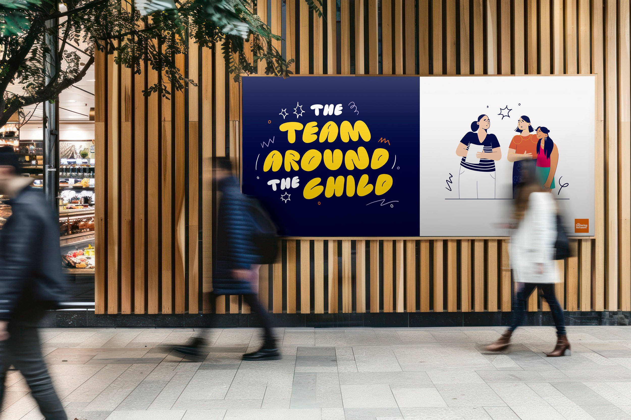 people walking past large poster