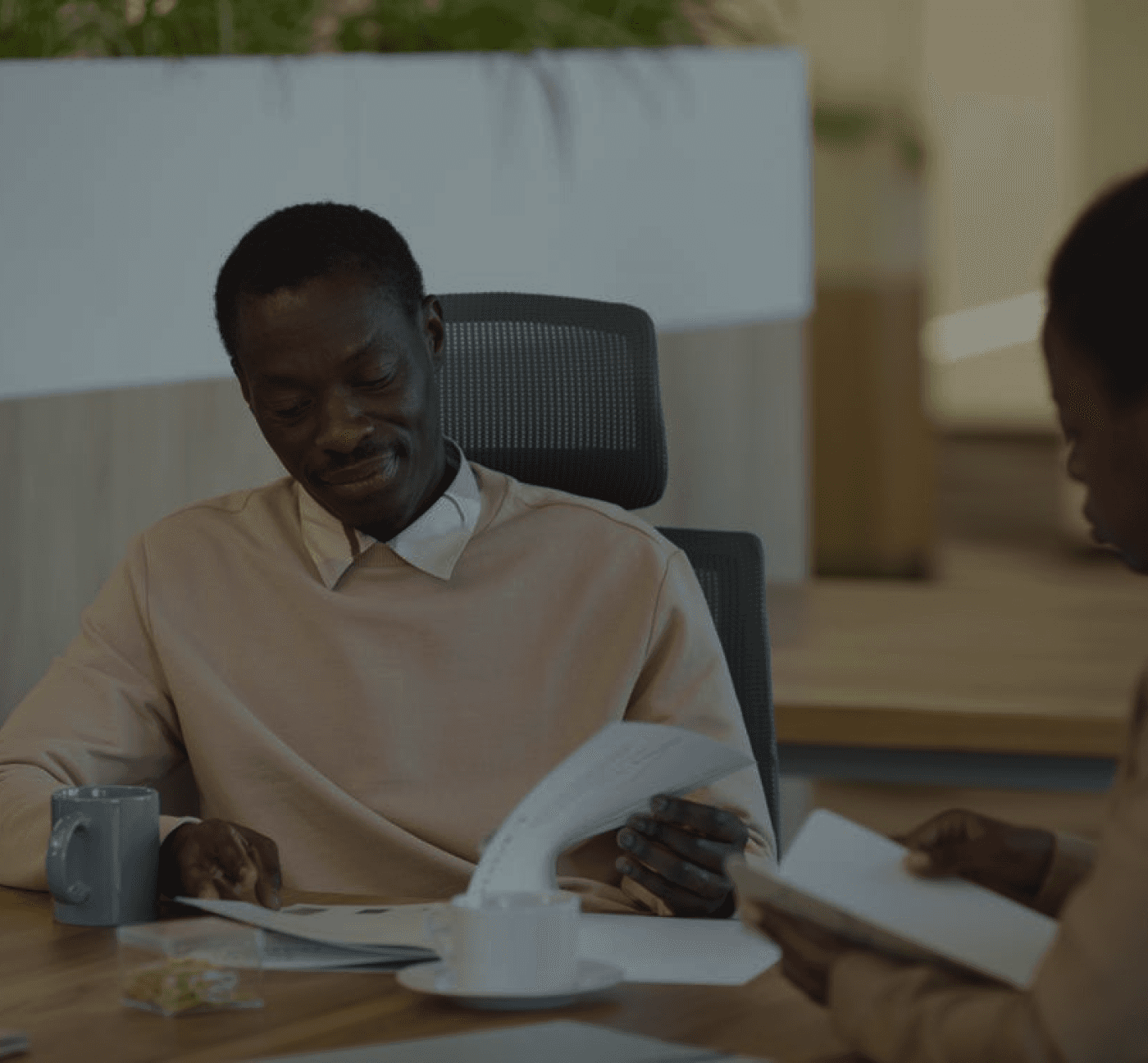 black man flipping through a paper