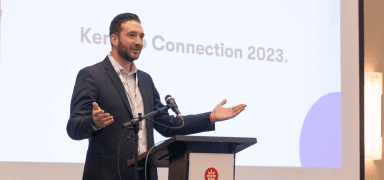 A speaker delivering a presentation at the conference.