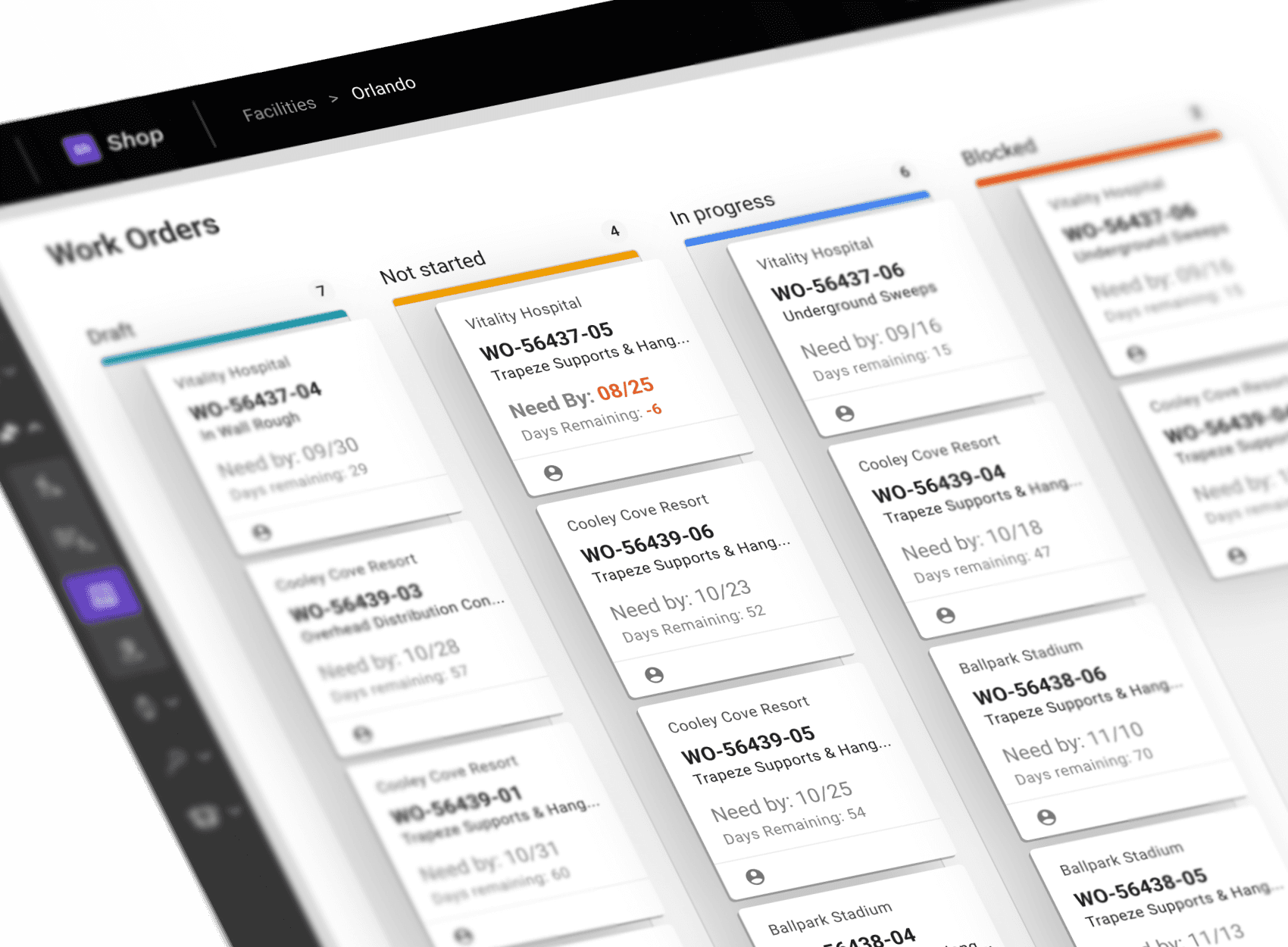 Two men in a prefab shop looking at a laptop