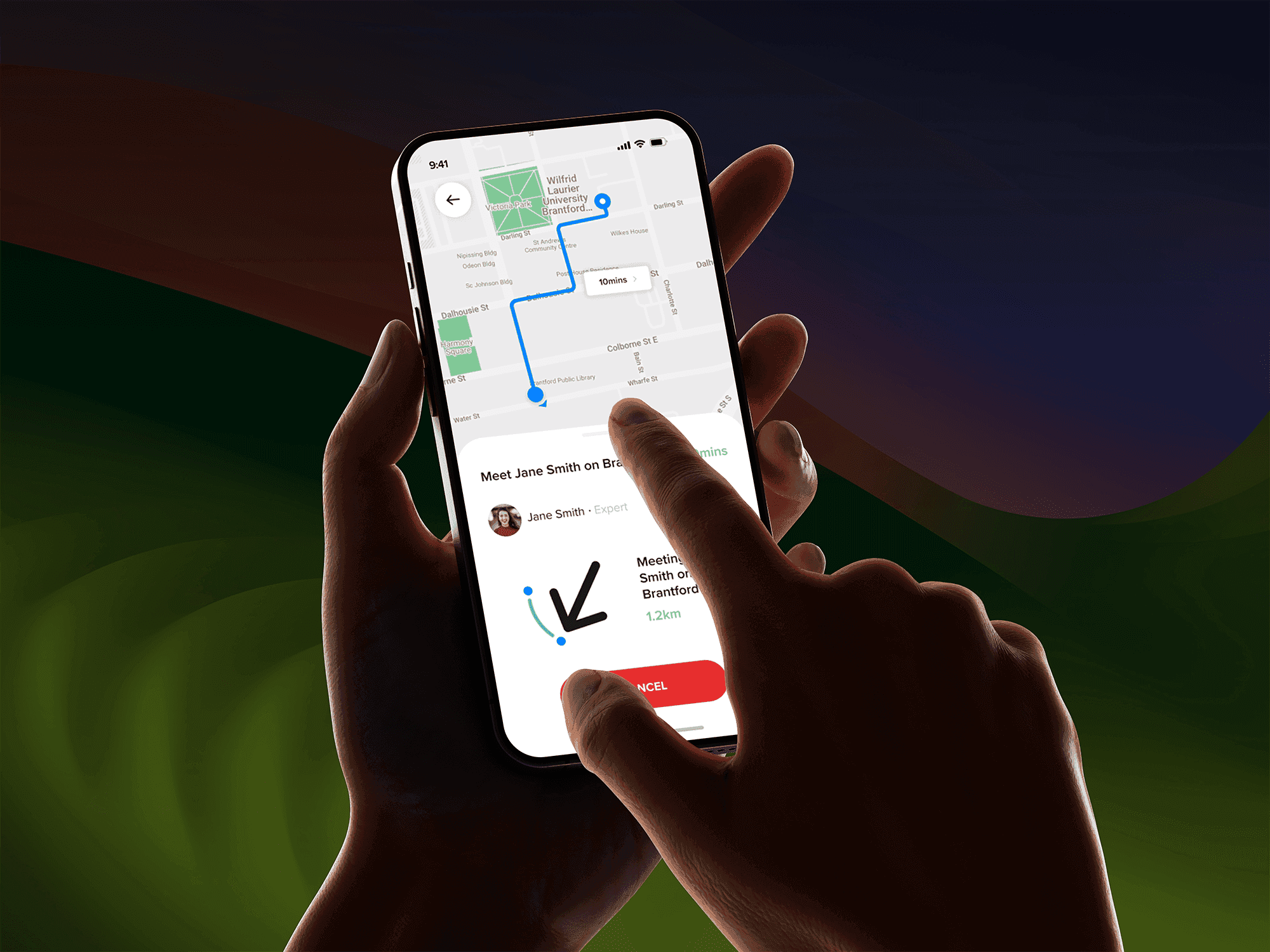 Close-up of a hand holding a smartphone displaying a navigation app with a route mapped out through Brantford, Ontario, showing a 10-minute travel time to a meeting point. The screen highlights a meeting with “Jane Smith” and a distance of 1.2 km, with a finger pointing at the cancel button on the app interface.