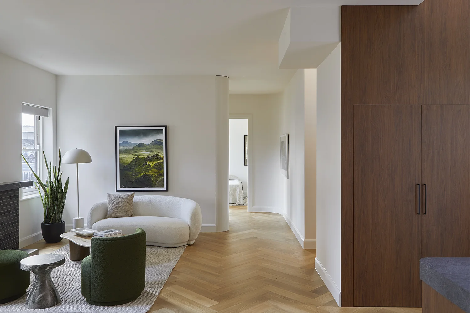 calming retreat area styled with a curved lounge and green accent chairs