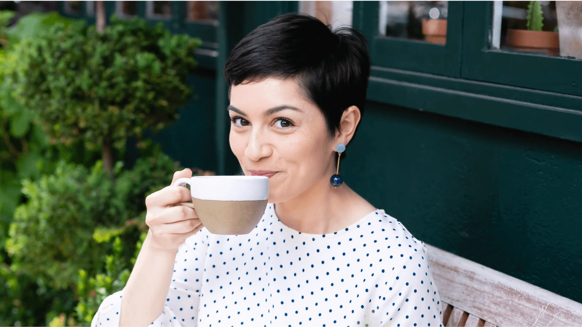 brand designer holding cup