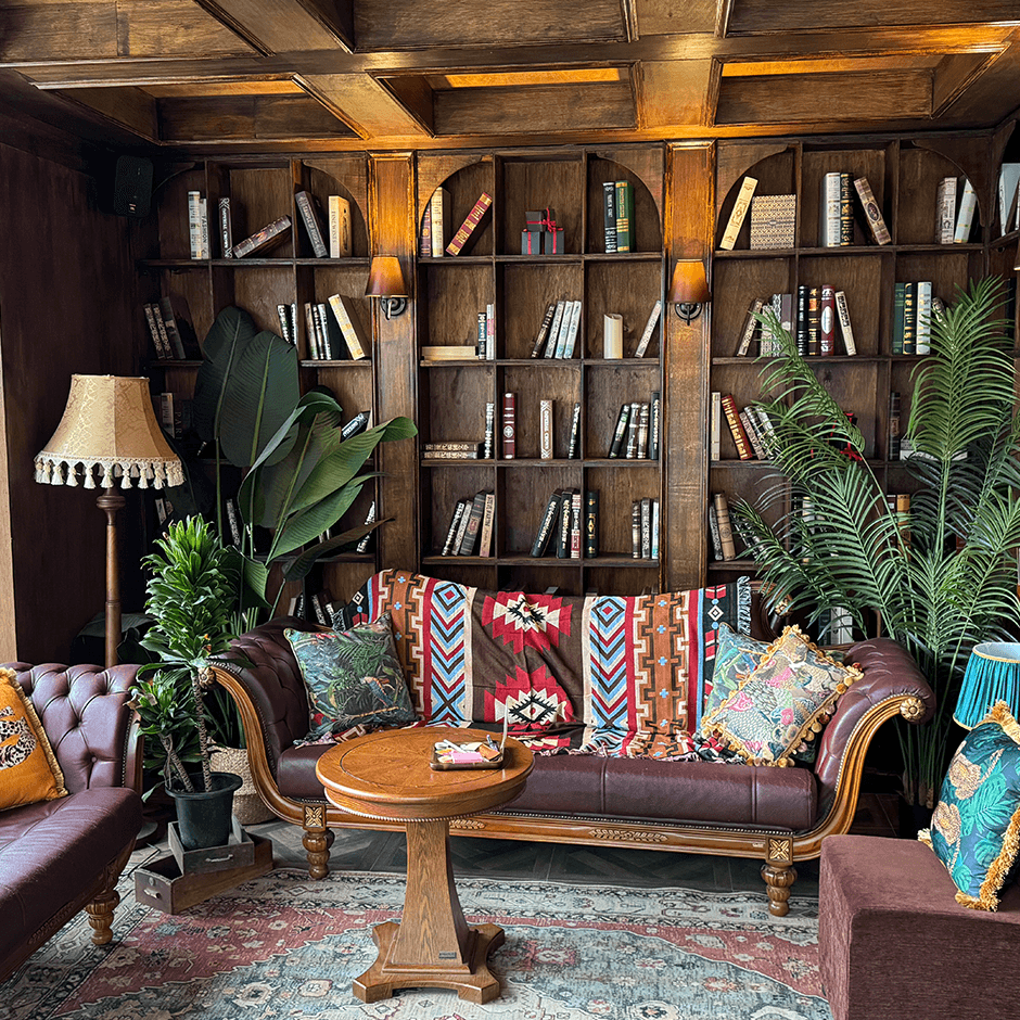 a couple of women in long dresses walking down a path