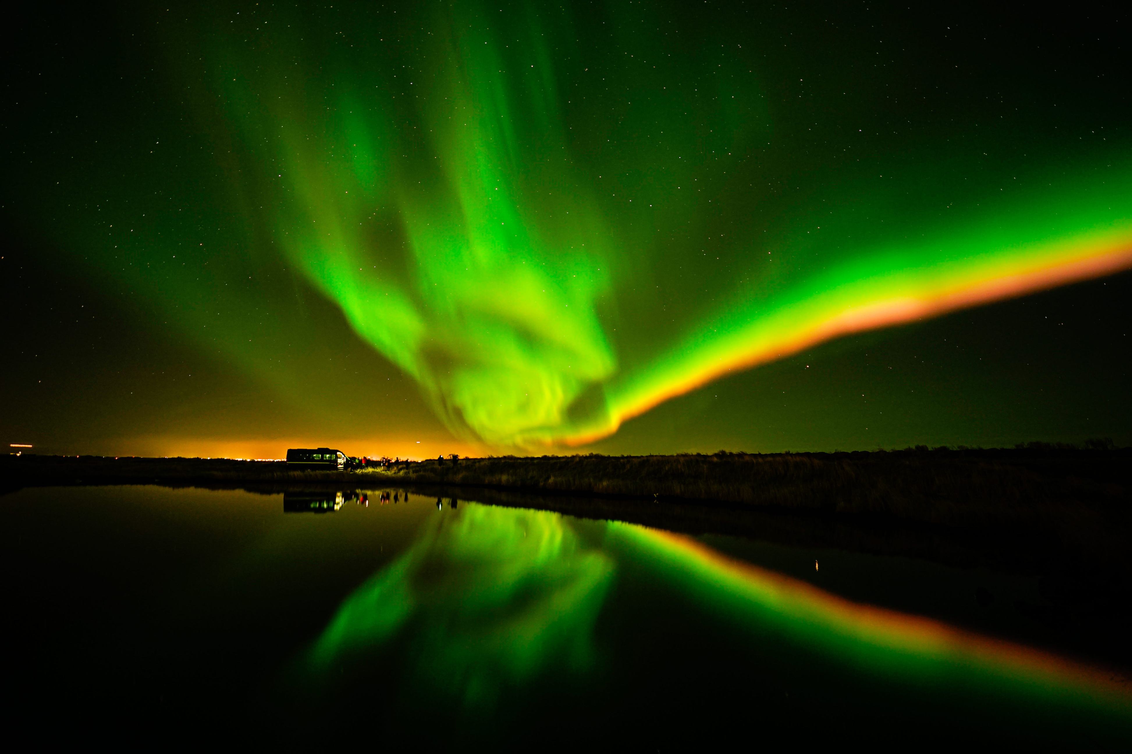 Northern Lights tour photography from Aurora Experts in Iceland, featuring guests beneath the aurora, winter landscapes, and vivid skies over remote Icelandic locations.