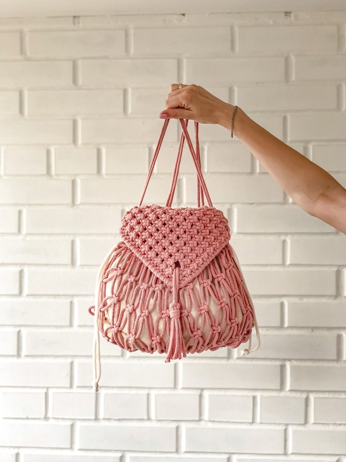 Handcrafted macrame drawstring bag with fringe detailing