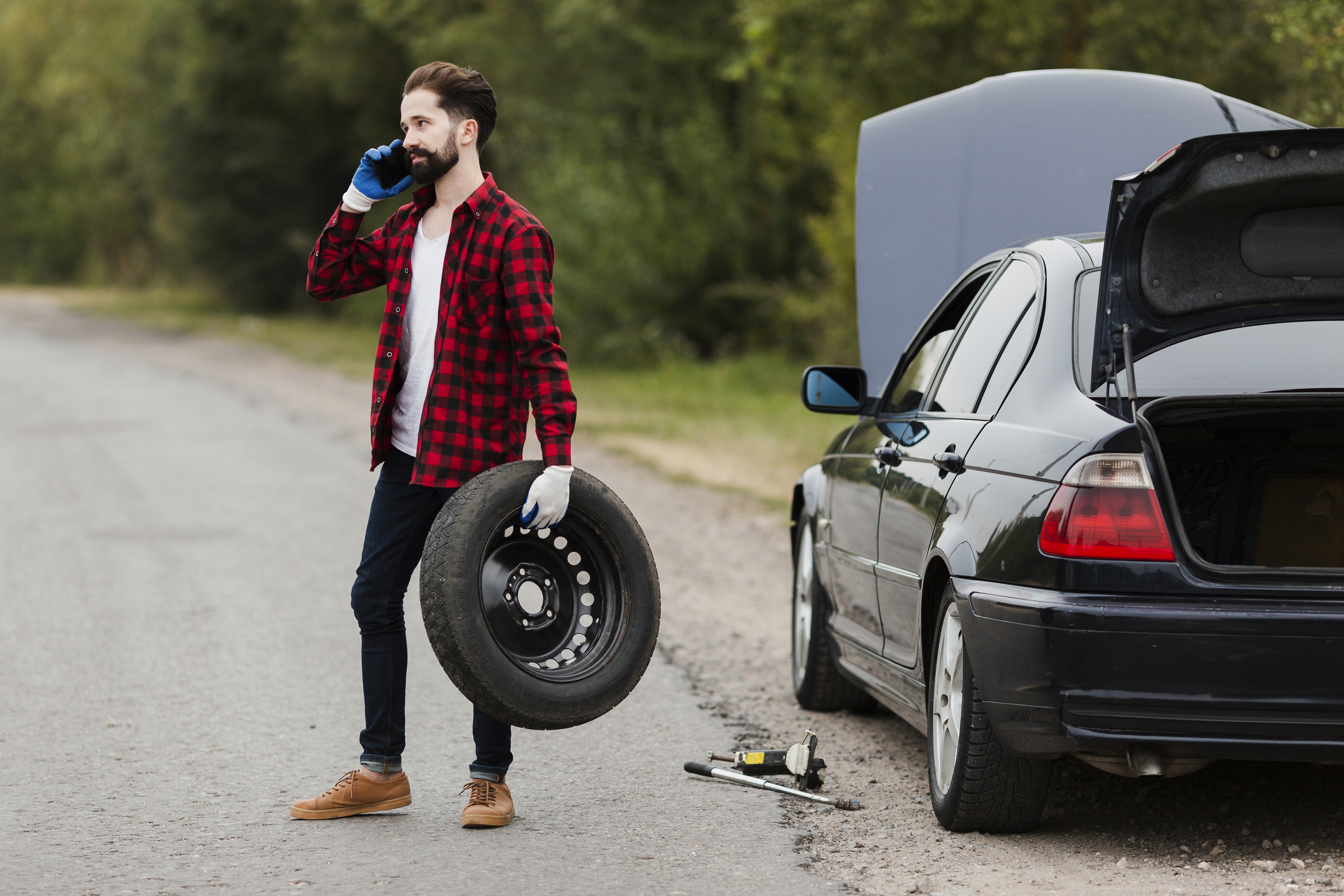 woman sitting around table holding tablet