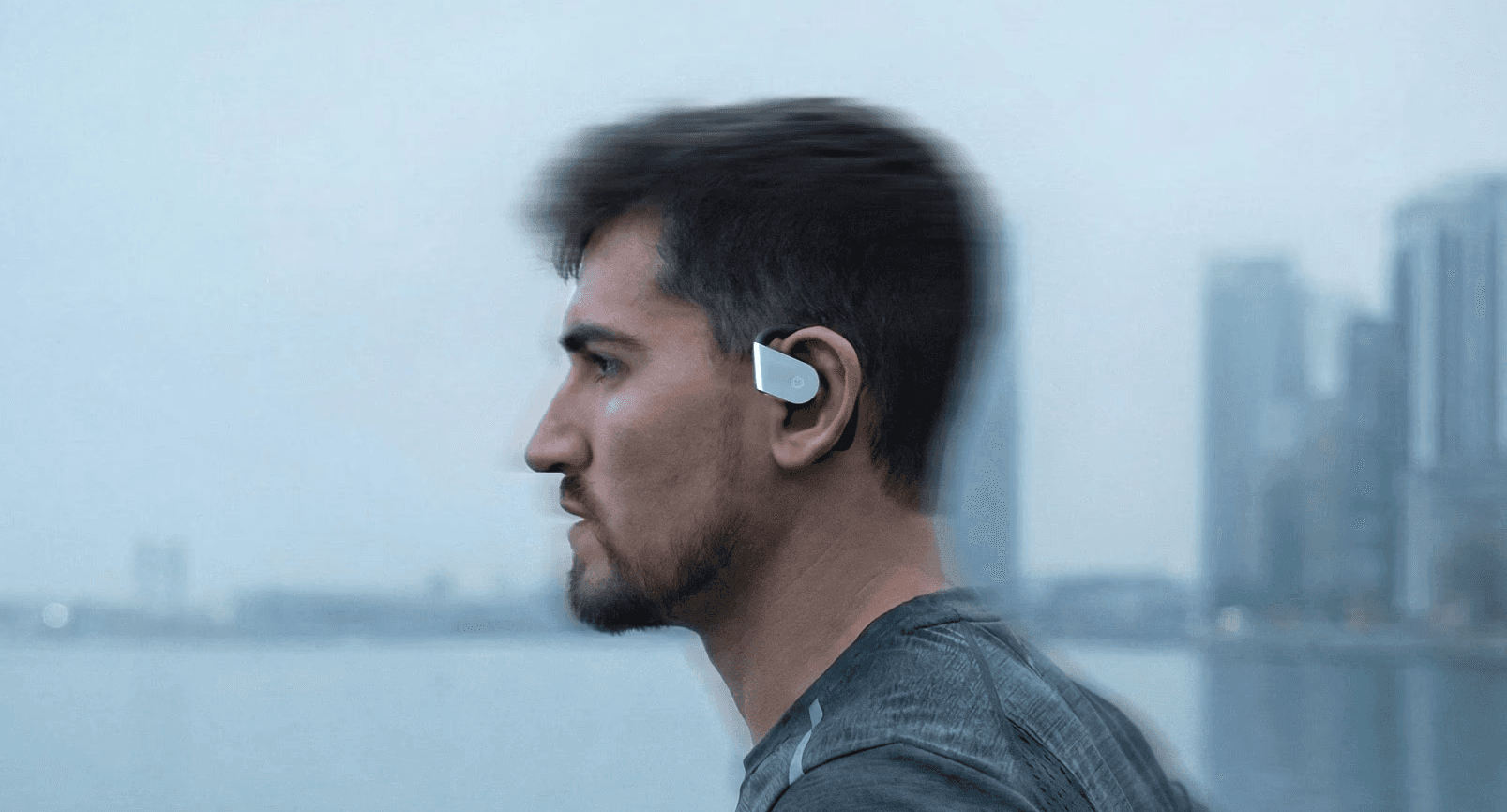 A person stands in a sandstone cave.