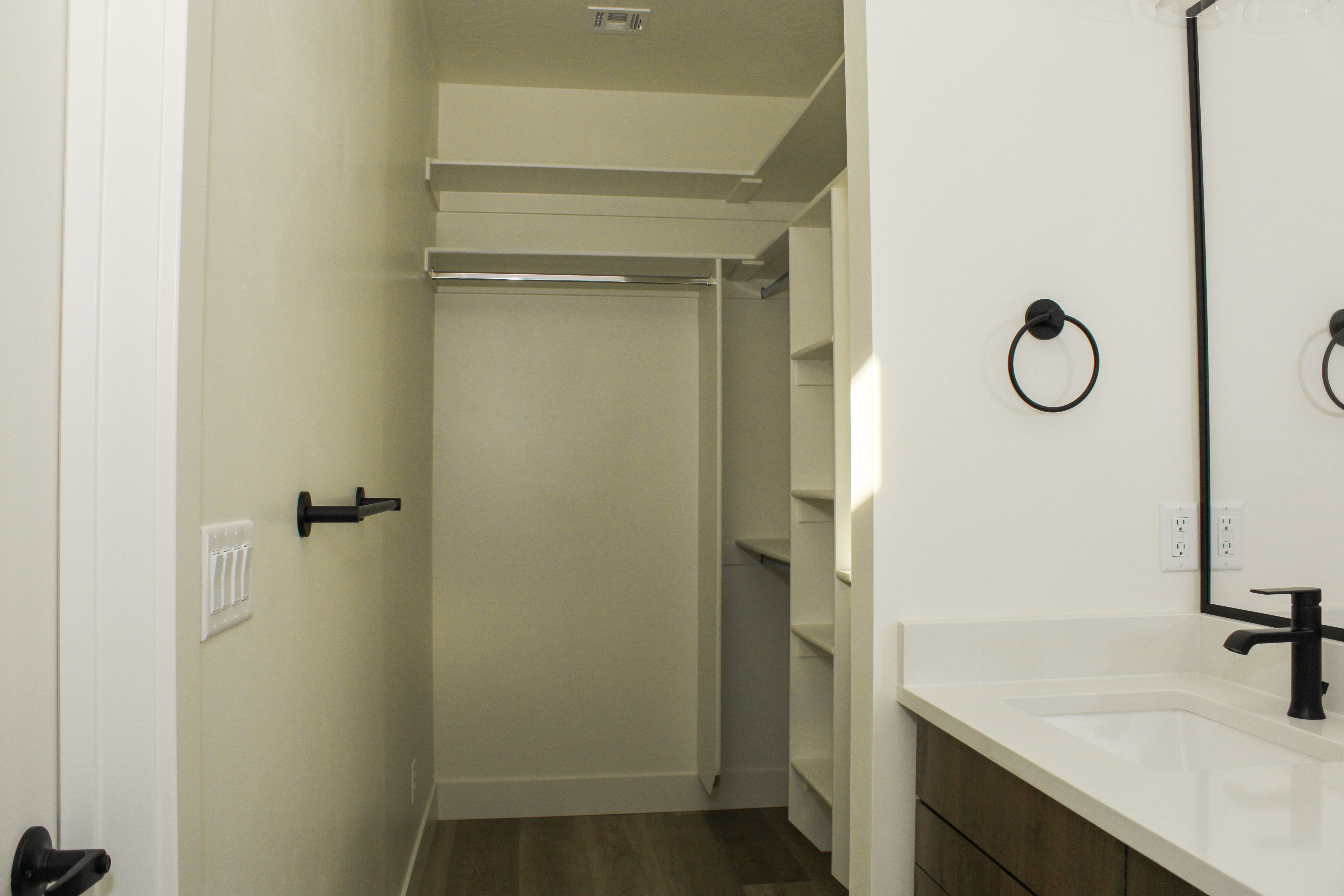 Primary suite bathroom in the Golden Hour home in Hurricane, Utah featuring a clean and functional design.