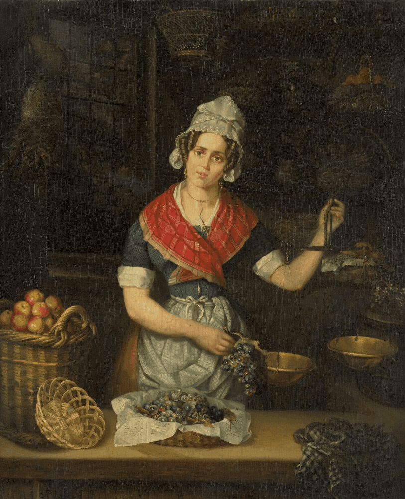 A woman in traditional attire, seated with fruit and vegetables, gestures while surrounded by baskets.
