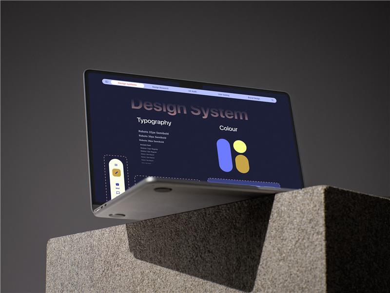 A laptop showing design system on a screen