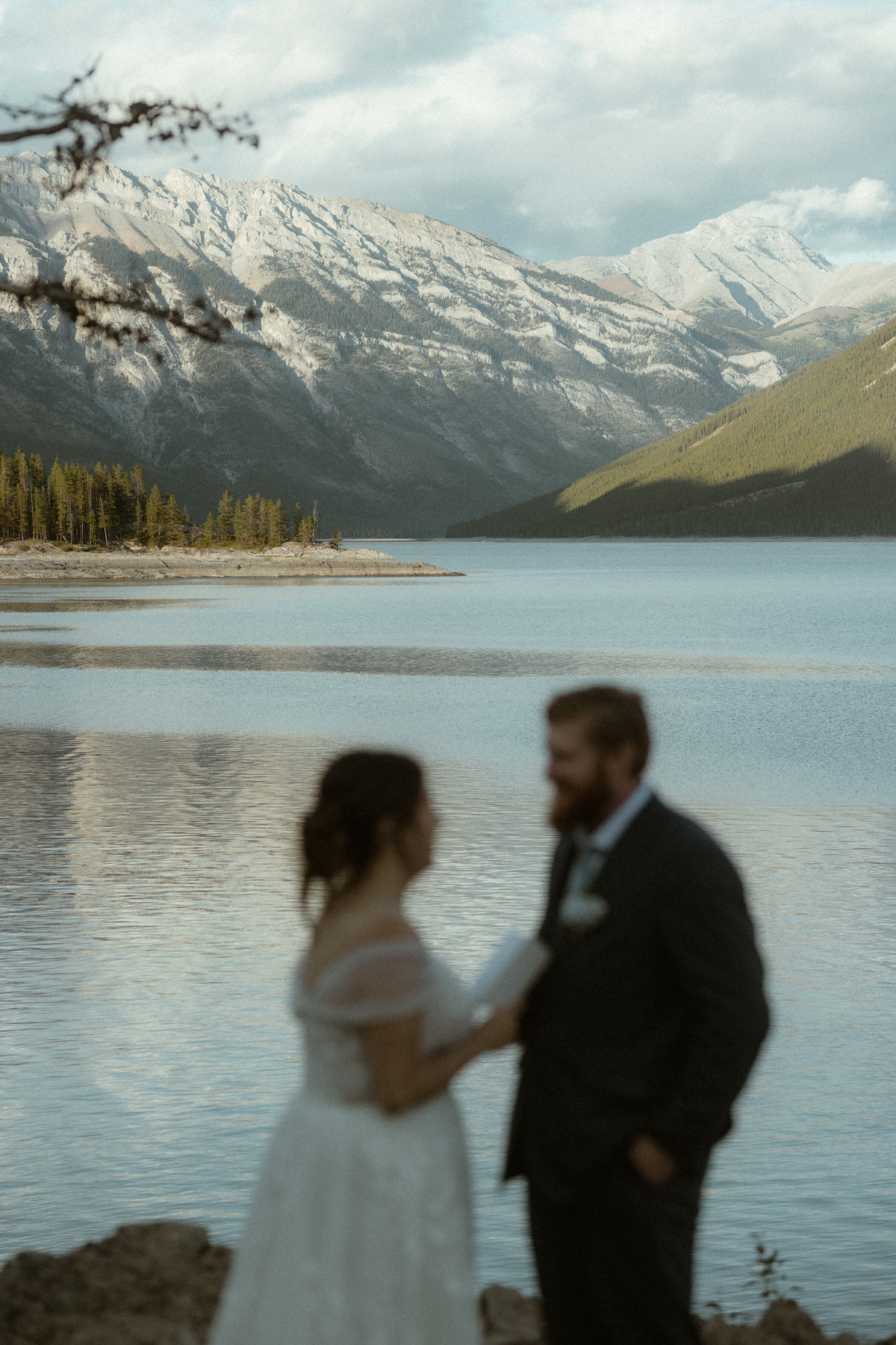 elopement ceremony at lakefront with mountains