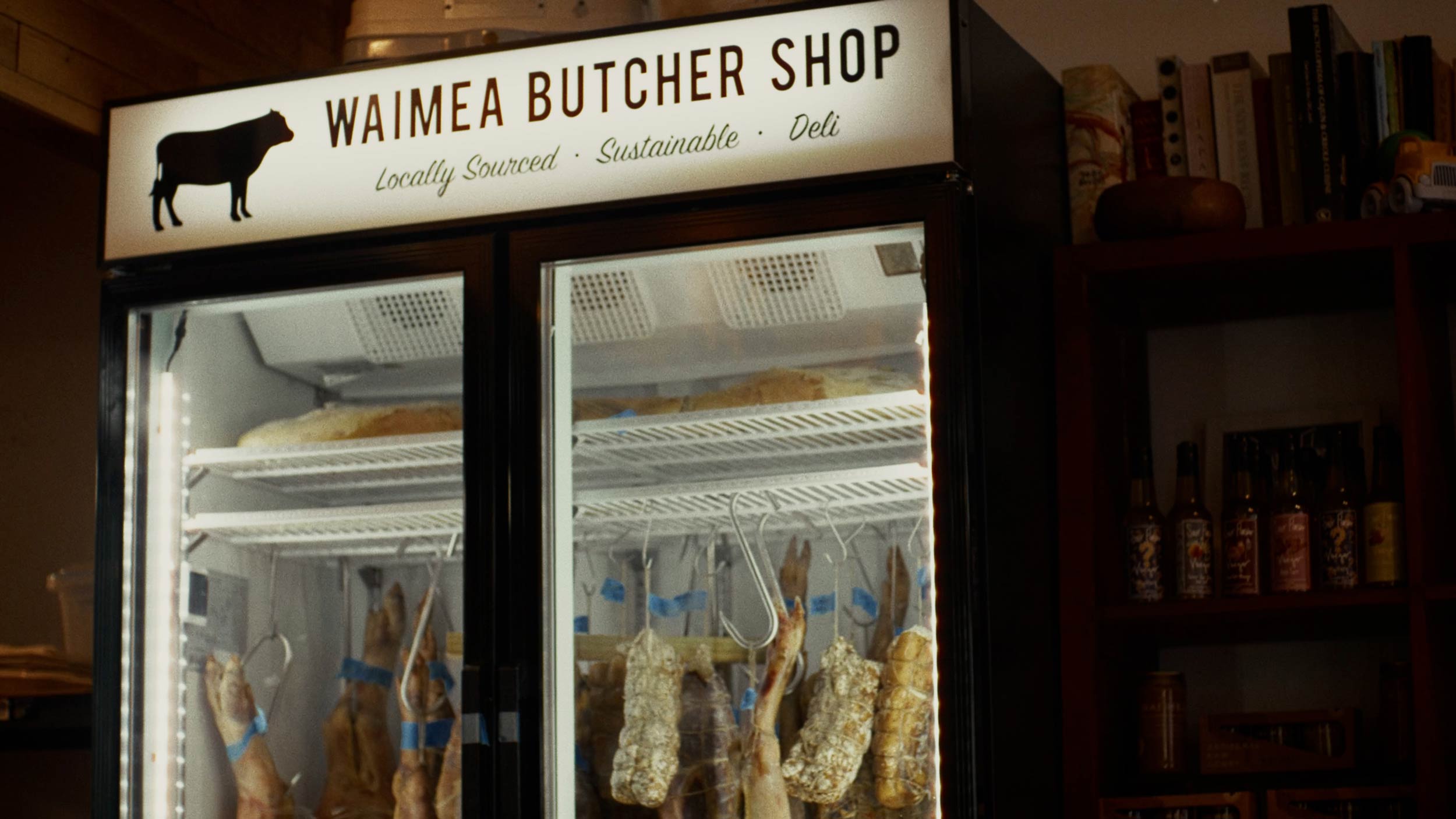 Streetside billboard with flyposters of the Batch.Works brand and illustrations