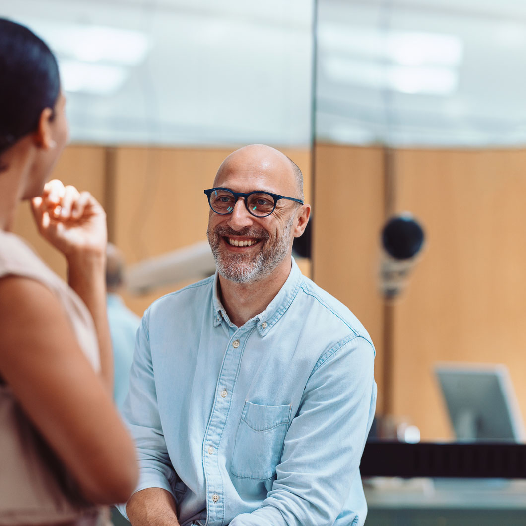 H1B visa lawyer consulting with client in office.