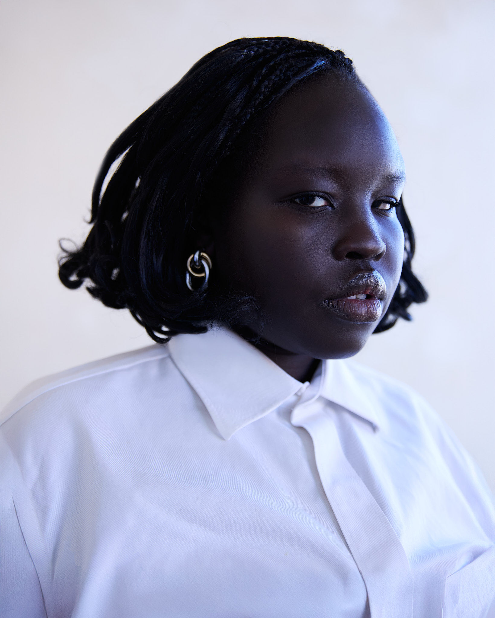 Sunlight streams through an arched window onto a ledge.