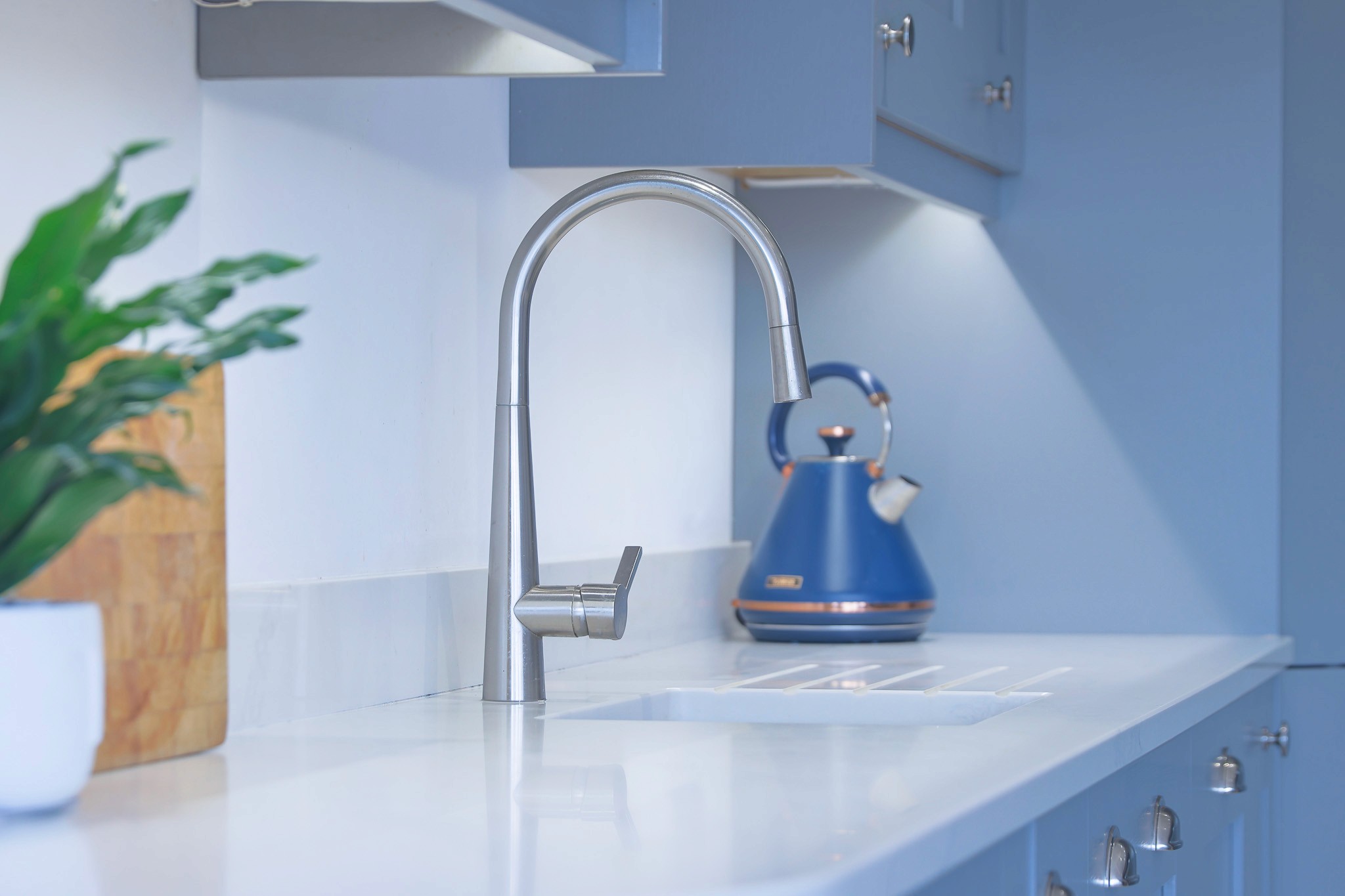 tap in blue shaker kitchen in chinley derbyshire