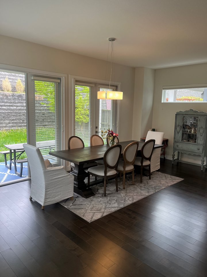 a group of young children riding skis down a snow covered slope
