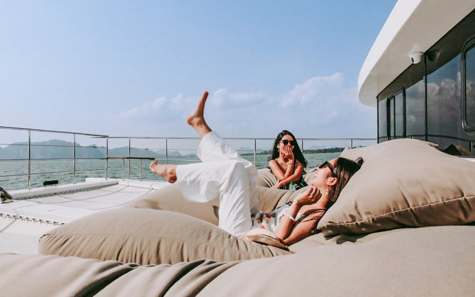 Tourists relaxing on a luxury catamaran en route to James Bond Island.