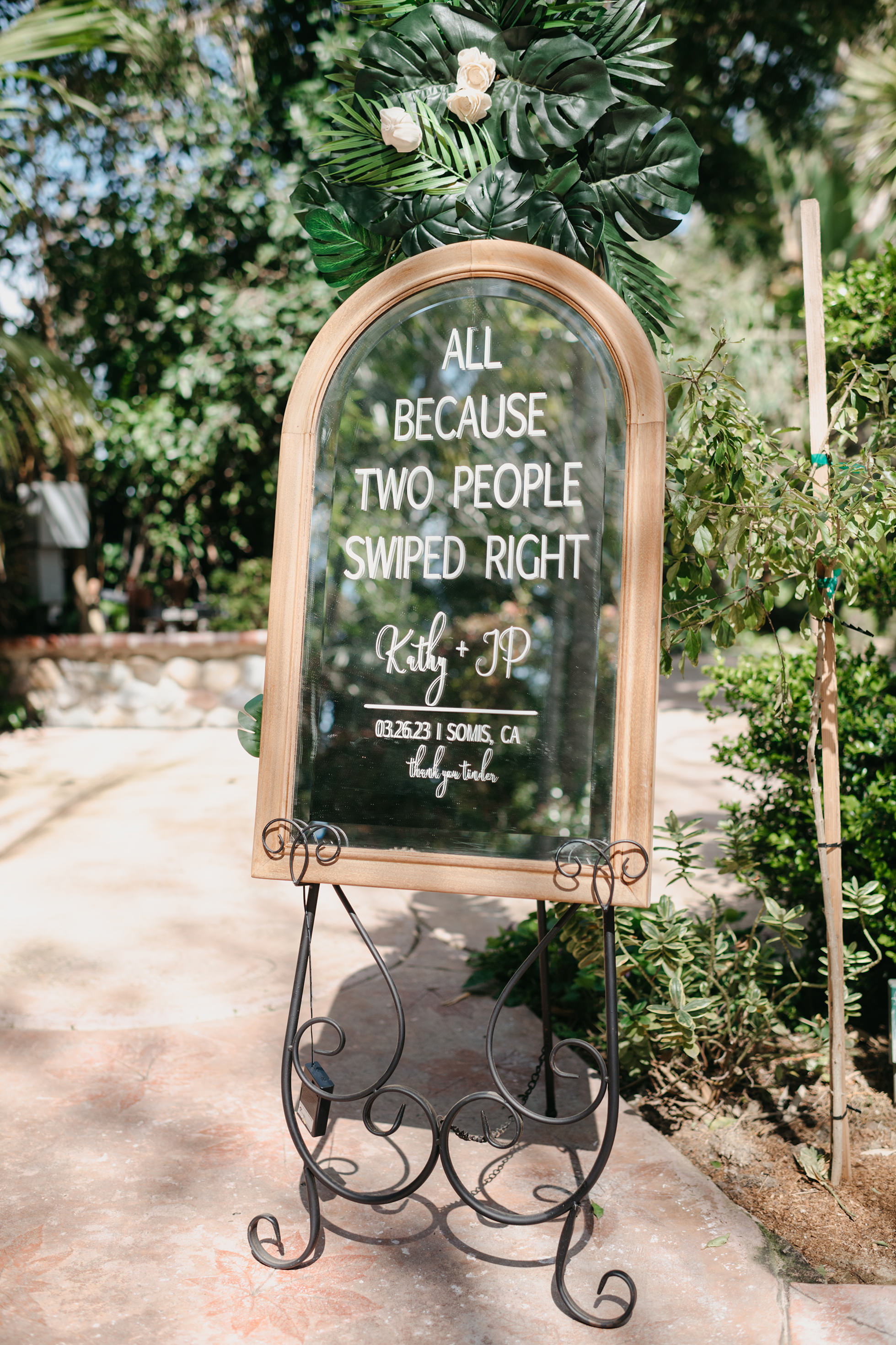 Flat lay wedding details with bouquet, rings, and sparkling bridal heels