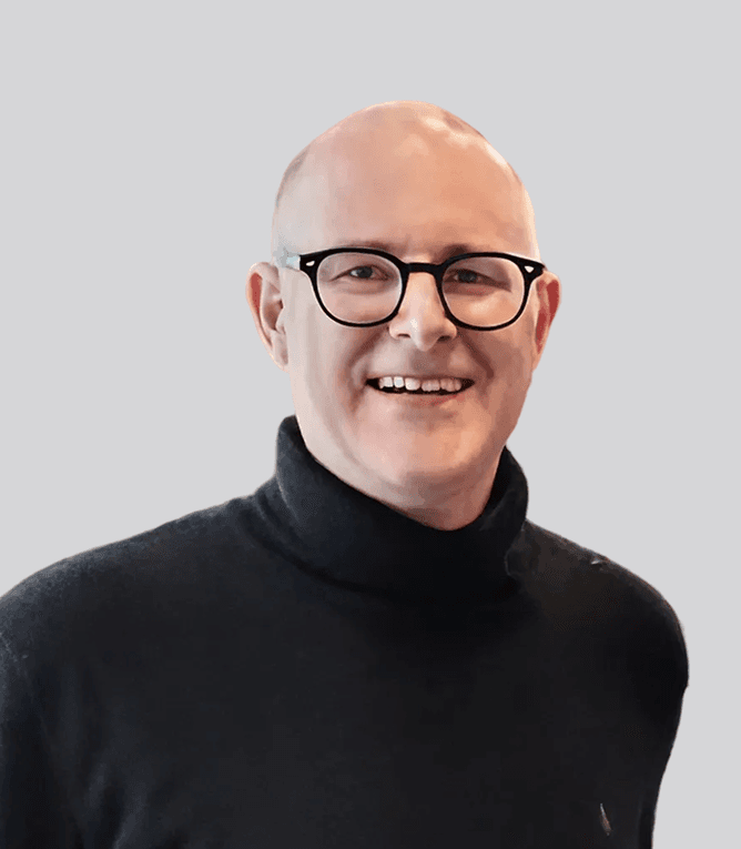 a woman wearing a hard hat holding a magazine