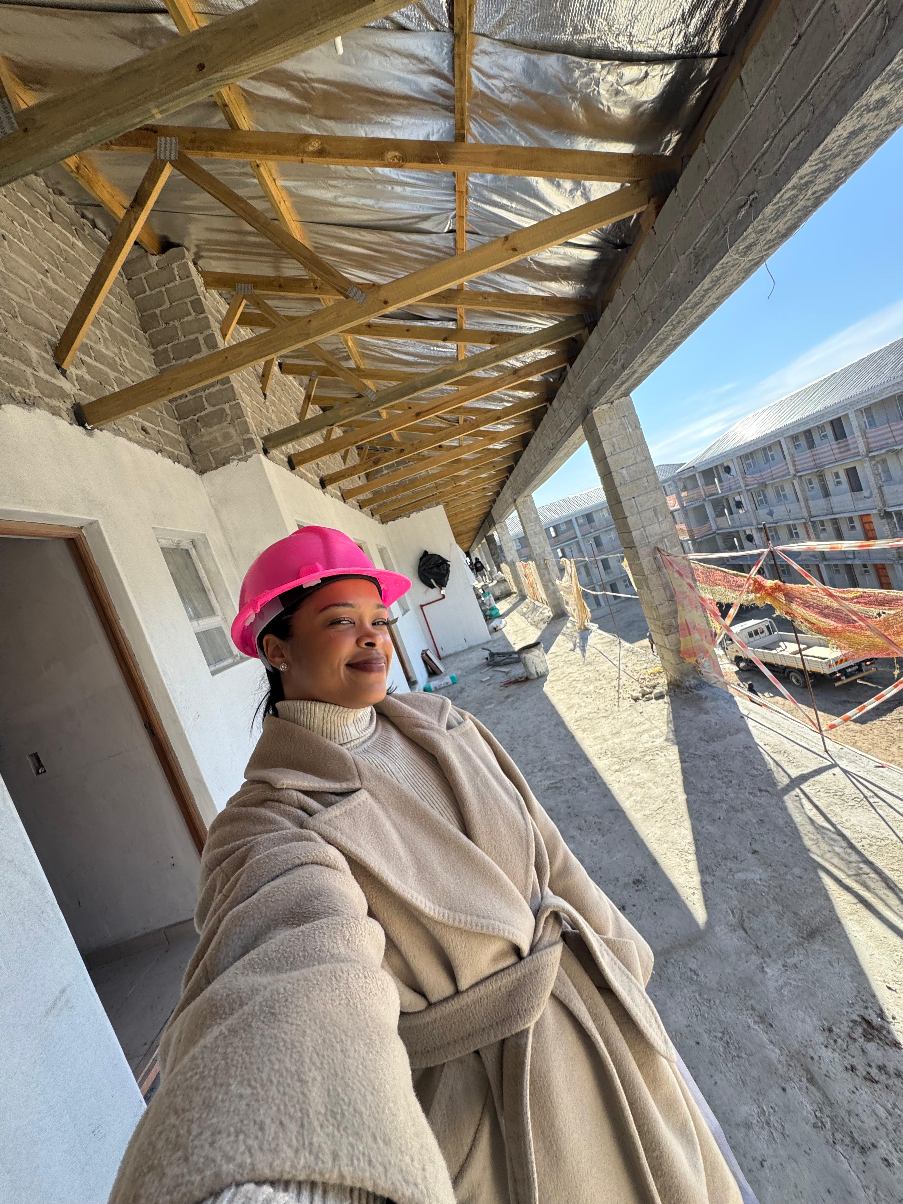 a woman with an afro is looking at the camera