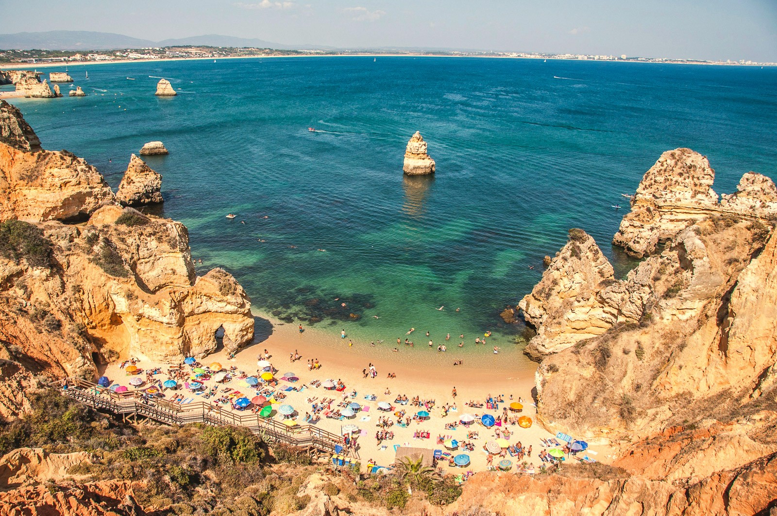 Dramatic rock formations on a rocky beach at sunset